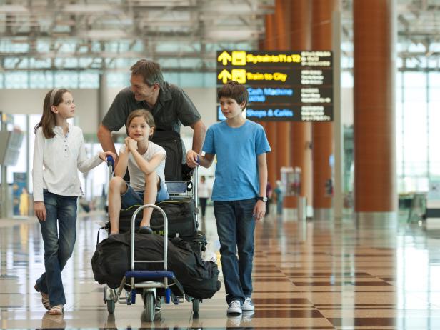 Family with luggage in the airport