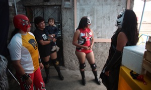 Lucha Libre wrestlers wait for their turn to perform.
